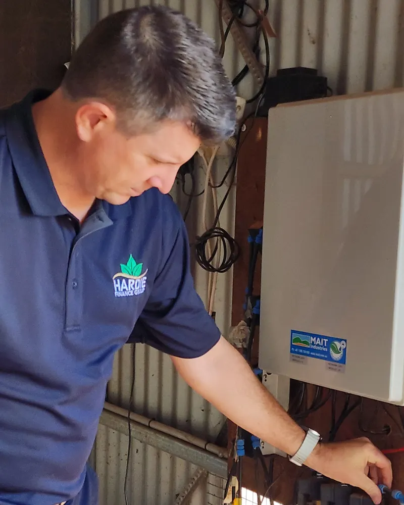 Adrian Hardie looking at a MAIT irrigation automation setup